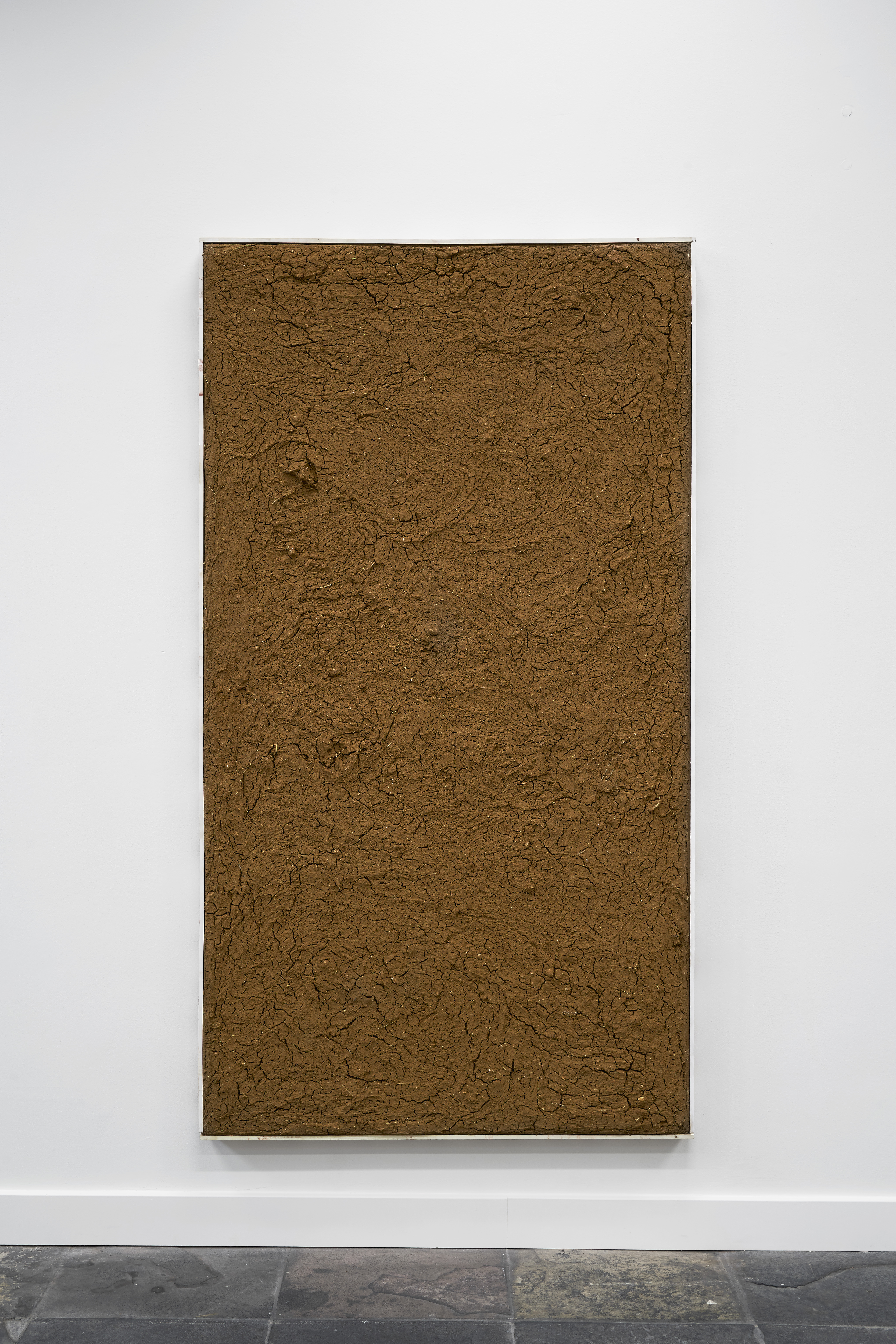 Hand dug and hand filtered Wiltshire clay on hessian, spray paint & pine, 205 x 112 x 5cm, 2021.