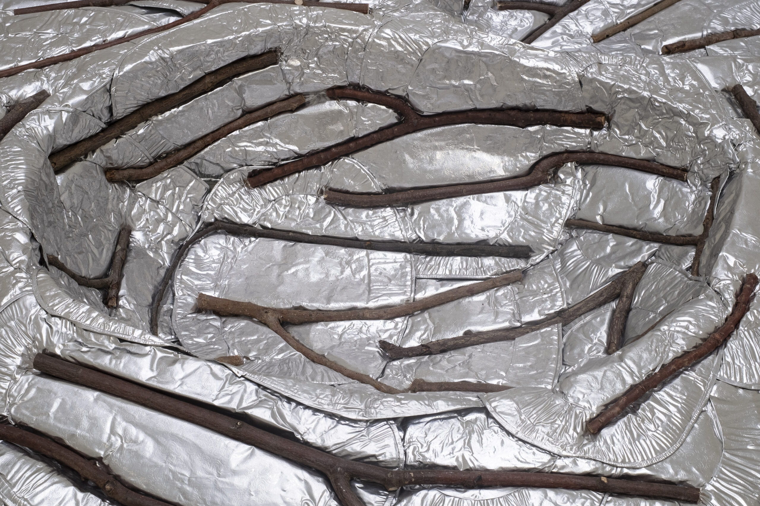 Twin Stickpool (detail), Embossed foil platters, sticks, 30 x 210 x 120cm, 2023